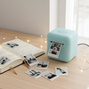 Mini Pocket Thermal Printer on a cozy desk with journal and fairy lights